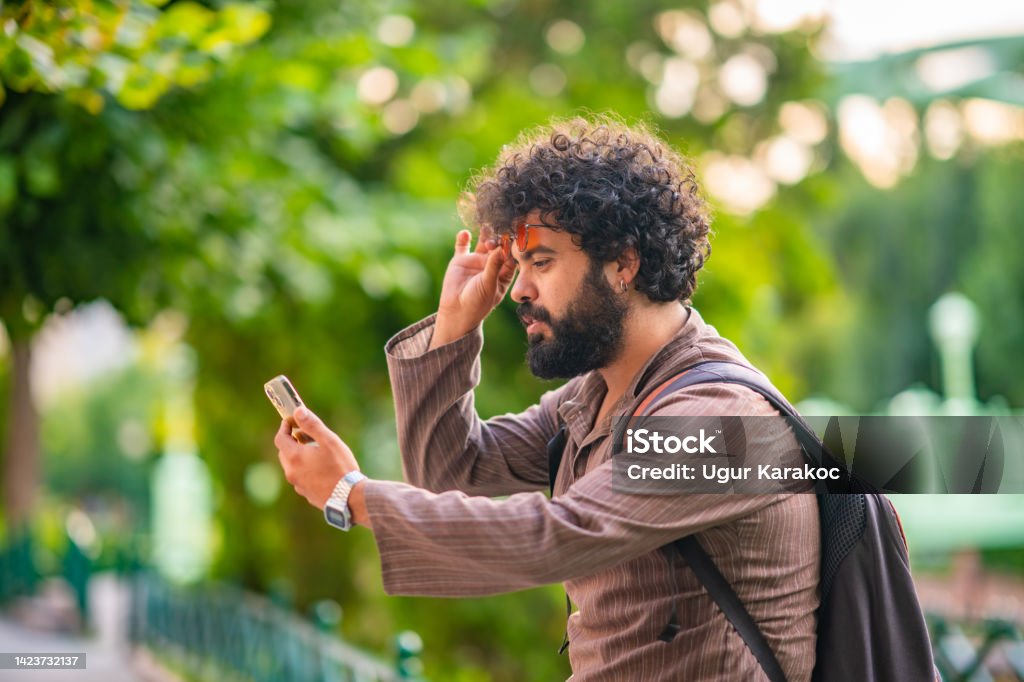 Man Using Devices Man Using Facial Recognition Tech Device Stock Photo - Download Image ...