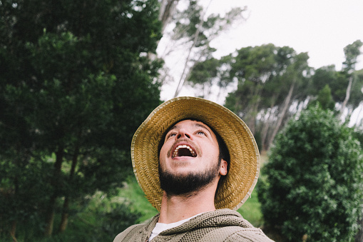 man smiling enjoying traveling and getting to know nature