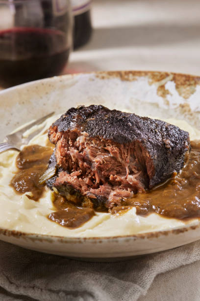 Red Wine Braised Beef Cheek with Creamy Mashed Potatoes Red Wine Braised Beef Cheek with Creamy Mashed Potatoes and Madeira Jus madeira sauce stock pictures, royalty-free photos & images