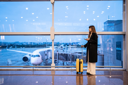 Young woman in the airpot
