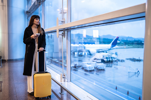 Contemplative young woman in the airport