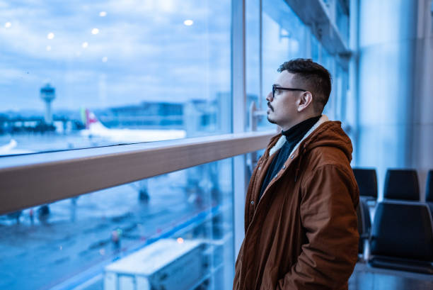 istock Contemplative young man in the airport 1423740852