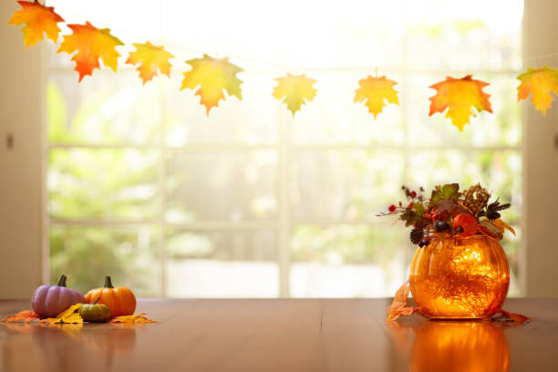istock Autumn home decoration. Pumpkin lantern. 1423743373