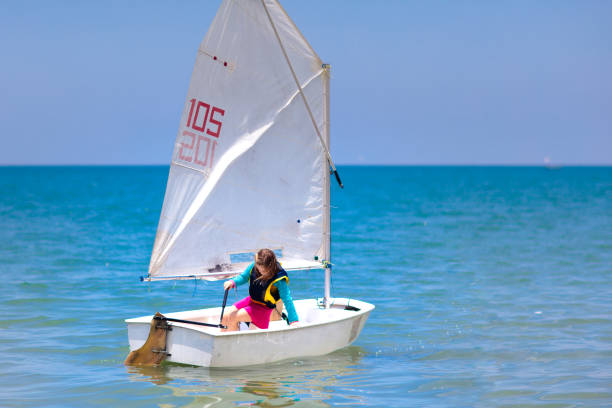 istock Child sailing. Kid learning to sail on sea yacht. 1423748311