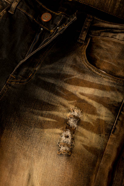 Close up view of a brown slim fit jeans Close up view of a brown slim fit jeans straight leg pants stock pictures, royalty-free photos & images