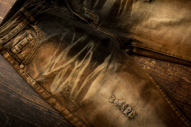 Close up view of a brown slim fit jeans Close up view of a brown slim fit jeans straight leg pants stock pictures, royalty-free photos & images