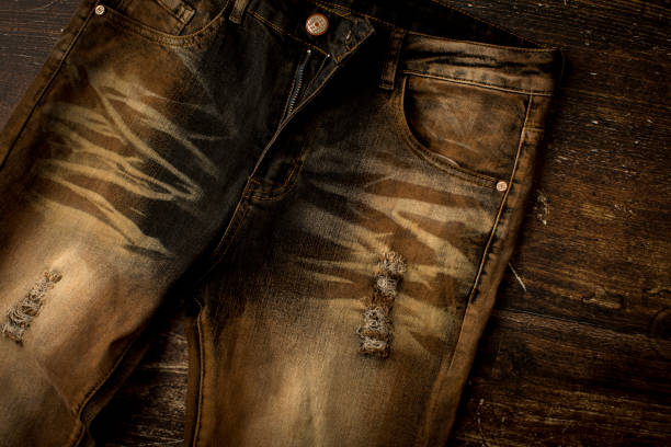 Close up view of a brown slim fit jeans Close up view of a brown slim fit jeans straight leg pants stock pictures, royalty-free photos & images