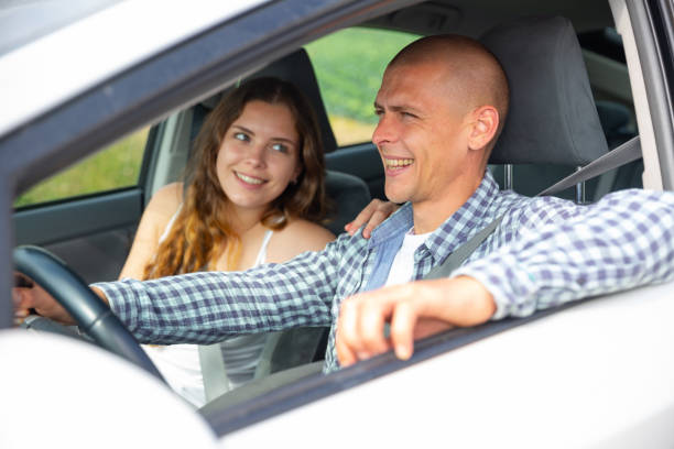 istock Woman and man talking in car during common trip 1423749122