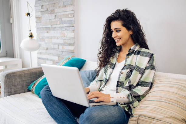 istock Woman enjoying at home and using laptop 1423766142