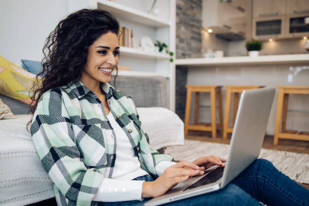 istock Woman enjoying at home and using laptop 1423766225
