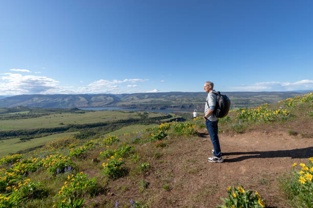 istock Happy and relaxed retiree enjoying an afternoon hike 1423766626