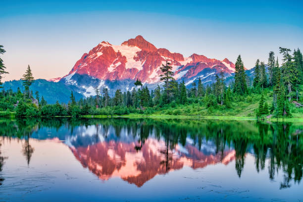 Mount Shuksan Washington USA Picture Lake Mount Shuksan reflecting in Picture Lake, Washington state, USA during a tranquil sunset. mt shuksan stock pictures, royalty-free photos & images