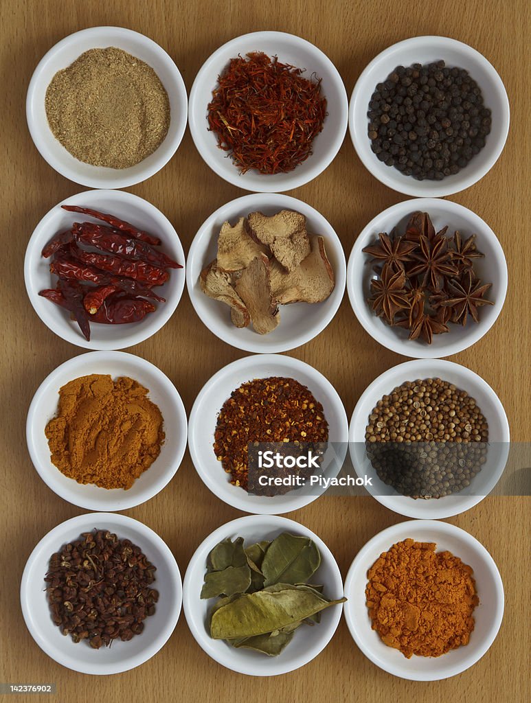 Collection of spices. Collection of different spices and herbs on wooden board Anise Stock Photo