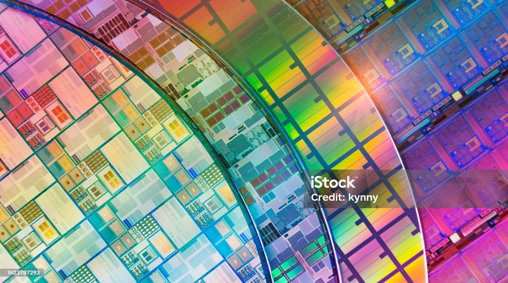 silicon wafer reflecting different colors. Semiconductor Stock Photo