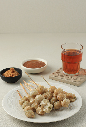 Cilok Skewer Peanut Seasoning, Deep Fried Tapioca Balls with Spicy Peanut Sauce. Copy Space for Text