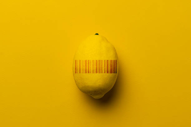 fresh new ripe fruit with a barcode on pastel background stock photo