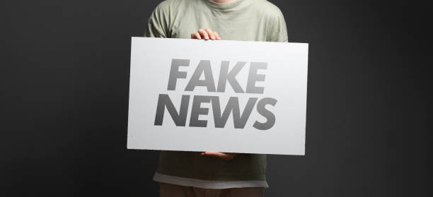 istock man holding a white frame with text 