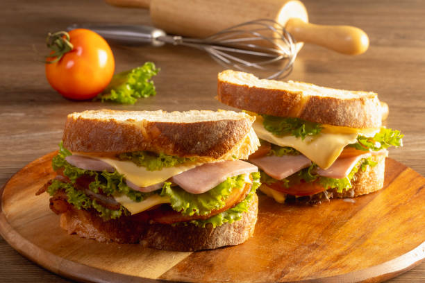 istock sandwich with ham and vegetables on a wooden table 1423797008