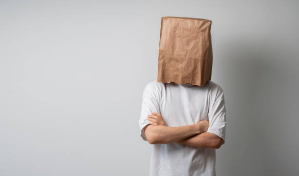 person with blank paper bag on head, mockup template