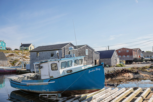 Peggy's Cove, Canada - August 29, 2022. A boat sits ashore on a boat ramp in Peggy's Cove.