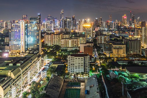 Bangkok City skyline view of Pathum Wan intersection Rama 1 Road, Siam Square business district cityscape at night, High angle view, Thailand
