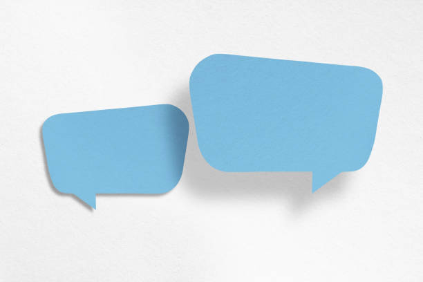 istock Speech balloon shaped blue paper isolated on white background. 1423803359