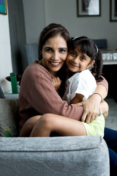 istock Cheerful mother and daughter having fun at home 1423814017