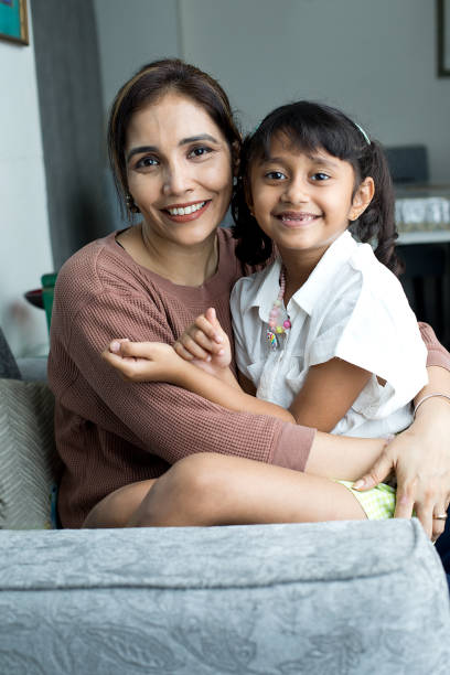 istock Cheerful mother and daughter having fun at home 1423814830