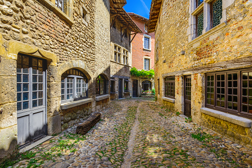 Small alley at Perouges village in France during a sunny day in summer