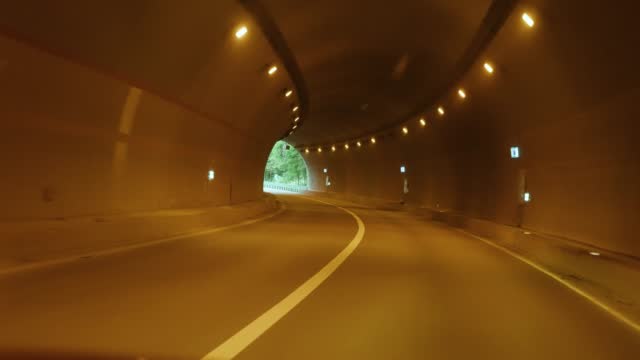 Car driving in the highway tunnel