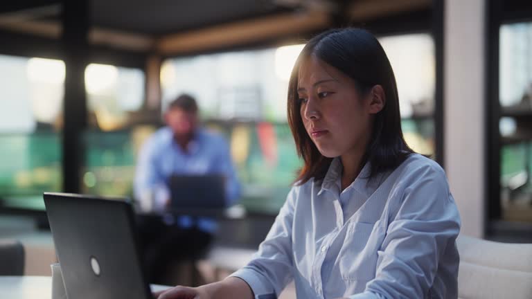 Group of business people working on their own in modern office working space