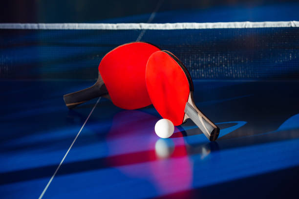 istock blue tennis table with two rackets, white net ball, leisure activities 1423822303