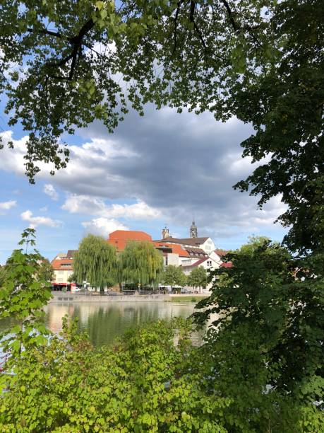 istock Old town silhouette with lake in foreground 1423823633