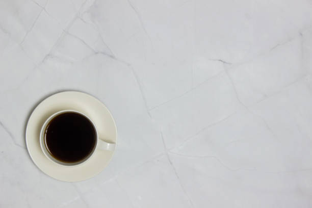 istock Black coffee over the light marble background with copy space. 1423823806