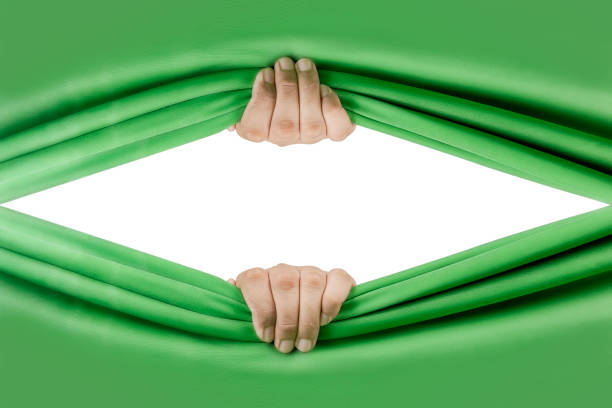 Human hand opening green curtain stock photo