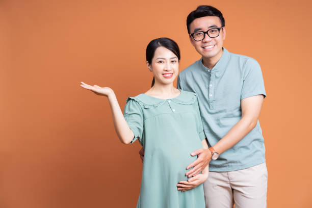 istock Young Asian couple on background 1423827272