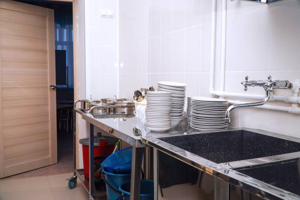istock Clean washed dishes in the kitchen of restaurant or cafe 1423828304