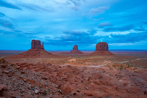 Towering sand stone buttes seen at Monument Valley during the golden hours in the evening. Located on the Arizona and Utah, USA.
