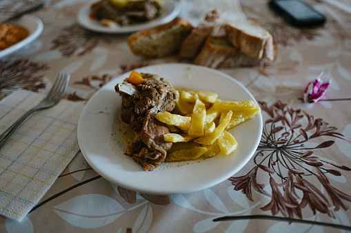 GREECE. Cyclades. Sifnos island. Monastery of the prophet Elias. Local cooked food with meat and potatoes casserole.