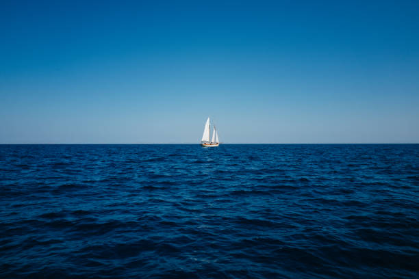 istock A sail boat at the open sea 1423839321