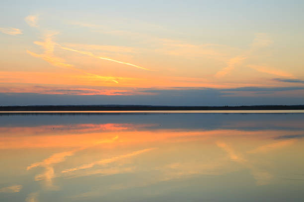 Reflection of a beautiful golden sunset over the water