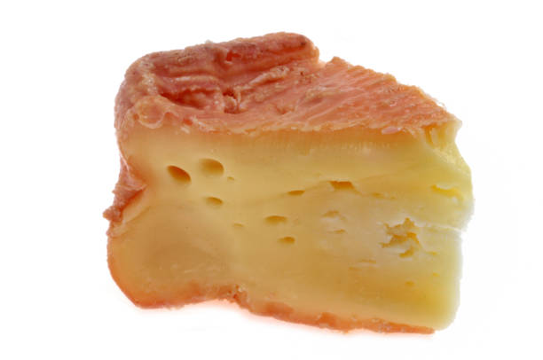 Portion of Maroilles cheese close up on white background