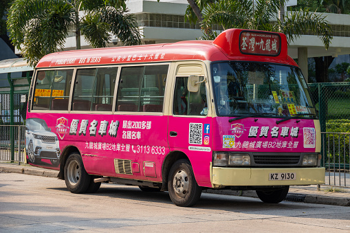 Hong Kong - September 13, 2022 : Red Minibus in Kowloon City, Hong Kong. This minibus is going to Tsuen Wan from Kowloon City.
