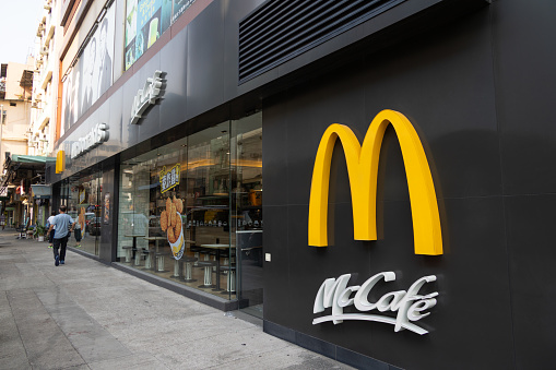 Krasnoyarsk, Russia - March 13, 2022: glasses facade of restaurant McDonald's. McDonalds fast food restaurant company has closed Russian branches