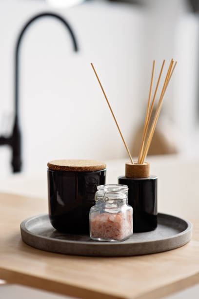 istock Spa treatment composition on wooden table, diffuser candles and pink sea salt for meditation and relaxation. Soft selective focus. 1423854669