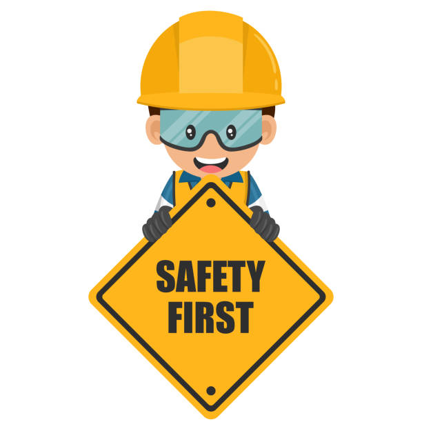 Industrial worker holding safety first sign. Engineer with his personal protective equipment. Industrial safety and occupational health at work Industrial worker holding safety first sign. Engineer with his personal protective equipment. Industrial safety and occupational health at work safety first stock illustrations