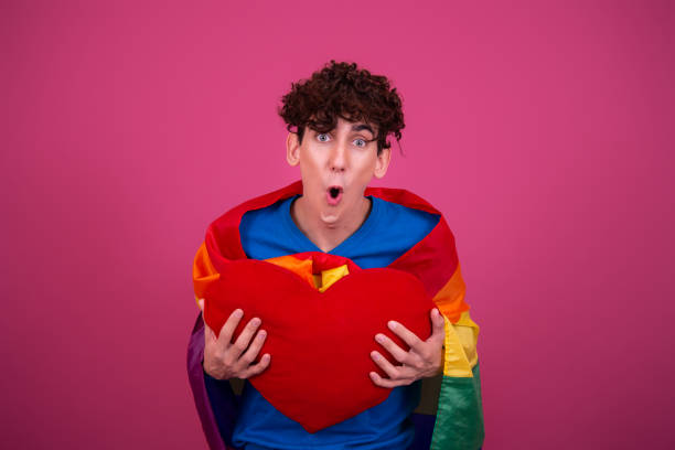 istock Young attractive guy with a rainbow flag. 1423854994