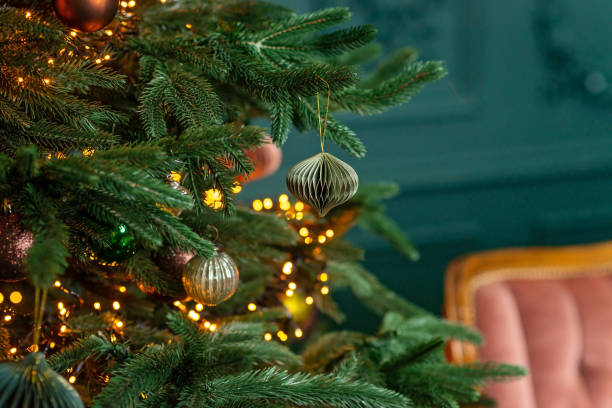 istock Christmas background, Christmas tree with festive balls and decorations, magic bokeh lights. Copy space, soft selective focus. 1423855393
