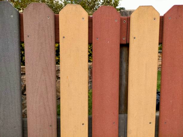 istock Background of a multi-colored wooden fence. 1423859587