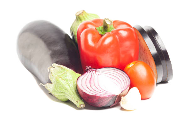 Fresh vegetables: eggplant,Bulgarian red pepper,red onion,garlic,tomato isolated on white background